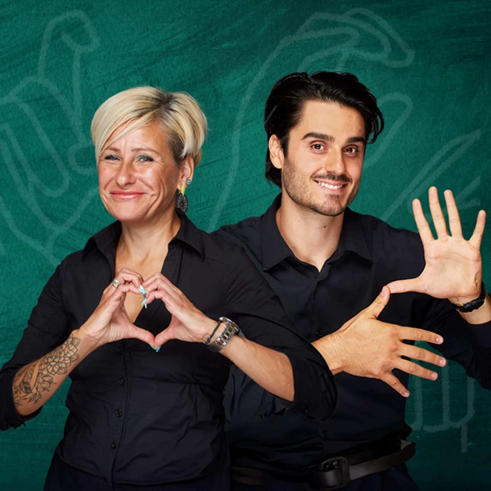 Two people smiling, one making a heart shape with hands, the other forming geometric shapes.