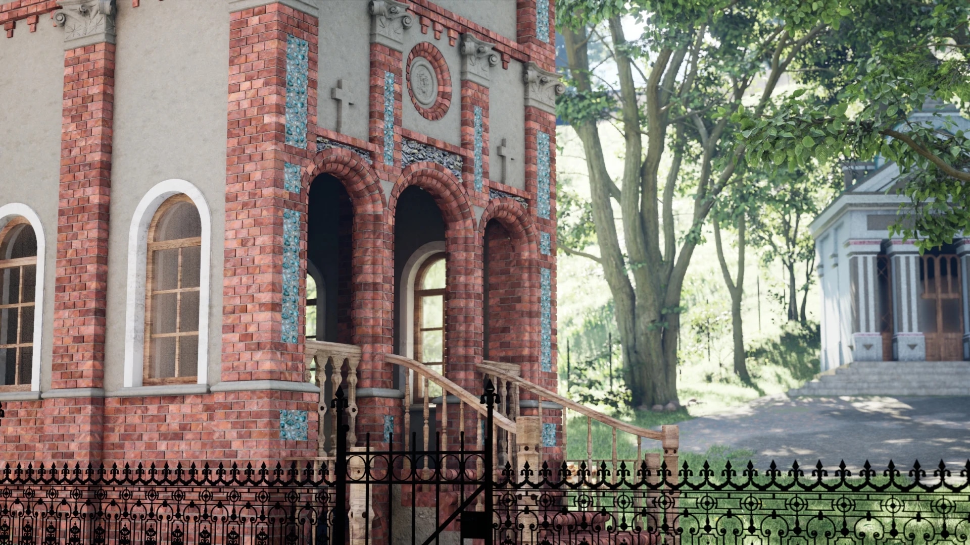 Red brick building with arched windows and ornate details next to a fenced pathway in a wooded area.
