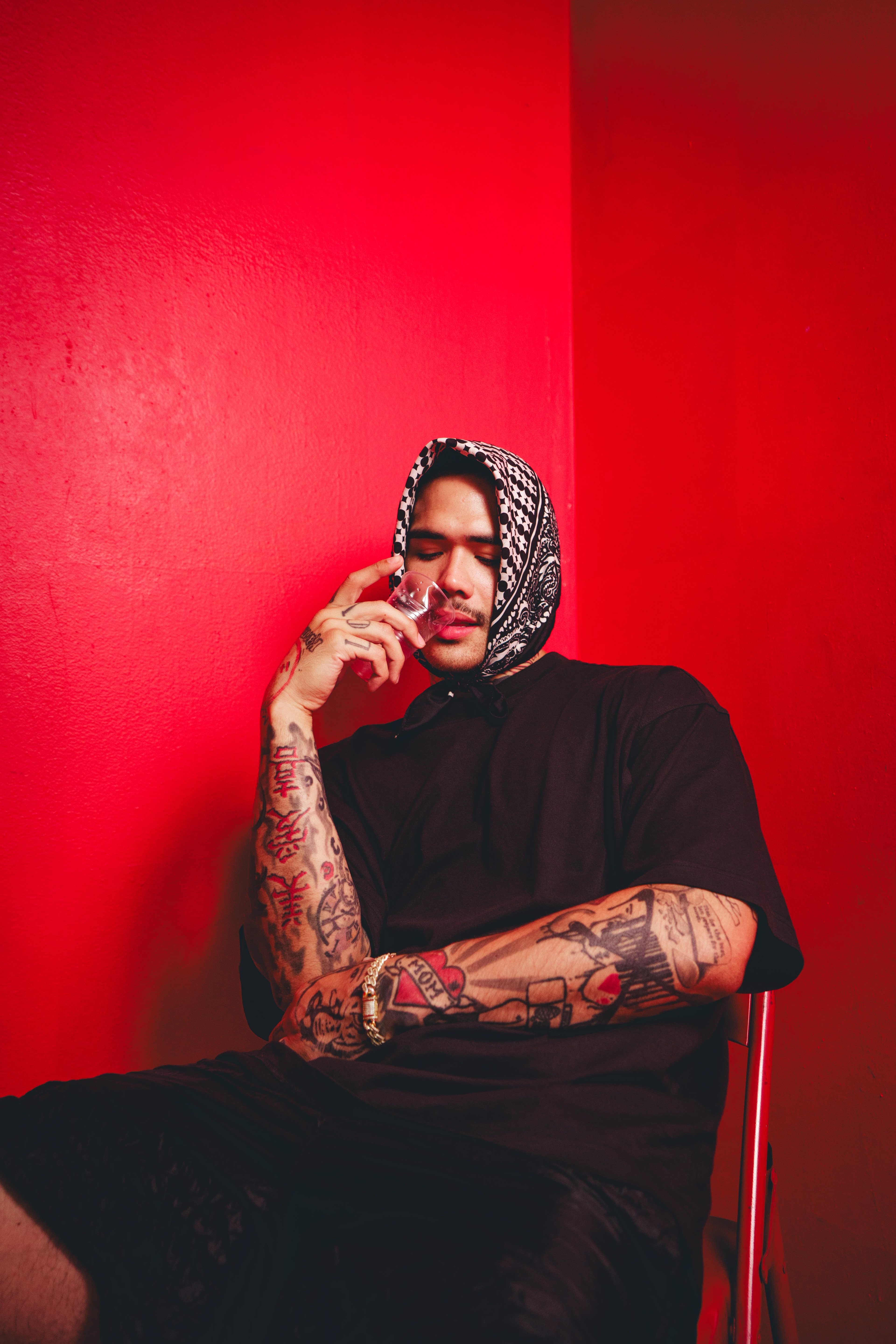 Person sitting in a red room